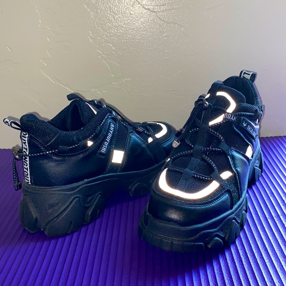 edgy, reflective, chunky black sneakers